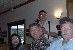 Vic and Lien Labelle with Robert Machen behind and Bud Gear in the hat at the Hillclimber pizza party.